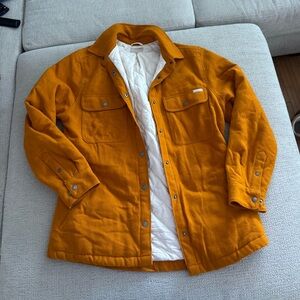 Born Primitive orange jacket